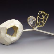 The quartz in between the hollow form and the wire structure shows the lovely connection and the chemistry of the two individuals. The negative space and the see through element reflect the color and the emotion of the wearer when worn. It also evokes the curiosity of the viewer.