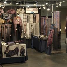 Booth with shawls displayed