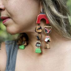 hand-cut tamarind hardwood and upcycled skateboards with hand fabricated oxidized sterling silver