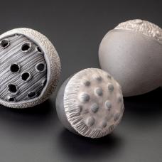 White earthenware  pinched forms with texture  slips  polished terra sigilatta  smoke fired