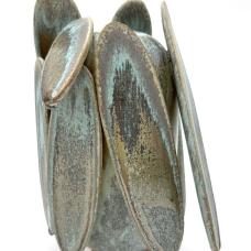 Camouflage and form meet in this Butterfly Lichen piece. Soda fired with multiple crystalizing glazes that break from browns to grays to turquoise to black. Colors change with each view on this tall ovoid form with large extensions.