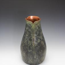 Hand raised copper vase with patina