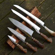 Five piece knife set consisting of paring  petty (utility)  chef  offset bread  and slicer. Matching handles of bocote  ivory G10  and spalted maple. The spalted maple is from my father's farm in Baltimore County  MD. The slicer has a deer antler that came from a whitetail deer shed that was found by my father in Anne Arundel County  MD. The utility knife has a laminated steel blade  with a wrought iron jacket. The wrought iron came from Amish Country in PA.