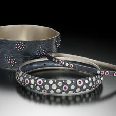 sterling silver bangles with rubies. lost wax cast and one of a kind.