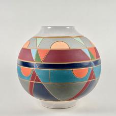 This globe vase evokes geometric and geologic realms  and is as functional as it is visually interesting. Made of brown stoneware with a satin white glaze  various colored underglazes  and is carefully carved.