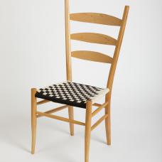 ladderback dining chair made with sugar maple and woven cotton tape seat.