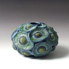 Black walnut hollow form with relief carving  pyrography  and dry brushed acrylics all from one piece of wood.