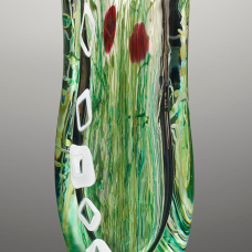 Blown glass sculptural piece features whispy strands of green cane to give the viewer the feeling of looking underwater.
