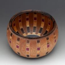 Chartres Anemone is a small intricate vessel of the Chartres series. Vertical stave construction with Honduras Mahogany and Maple veneer. 6 specie of wood and 300 individual pieces  Ebony base and Rim