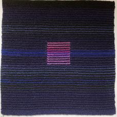 knitted dark purple and blue square with a smaller bright purple square in the center
