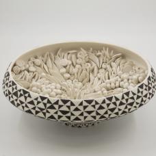 Made from porcelain on the wheel hand carved handmade embellishments high fired.