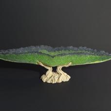 Hand-carved ceramic base with cast glass vessel