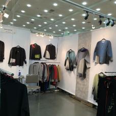 Booth with clothing hung on display