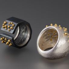 Sterling silver and 18k gold cast and fabricated domed and split rings.