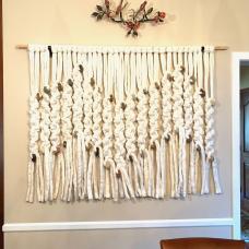 Ultra soft plaits of hand-felted Merino wool fall down the wall in this tapestry composed of double tatted chain knots.