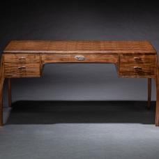 A desk in amazingly figured Claro walnut wide and deep enough to command a presence in any space.