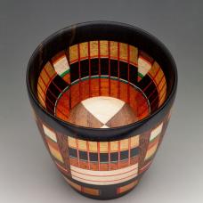 The Odyssey series is a new endeavor  combining different lamination techniques is a single piece. A colorful vessel with 8 different specie of wood and dyed Maple veneer.