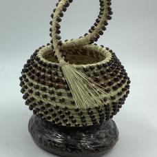 South Carolina sweetgrass baskets with a wooden beads provide to highlight each stitch.