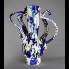 Handformed earthenware sculptural vessel created using a series of slumped forms parts of which have been manipulated and assembled creating one of a kind forms that are then multifired for the desired glaze effect