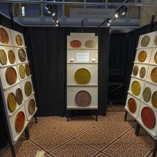 Booth with circular objects on display