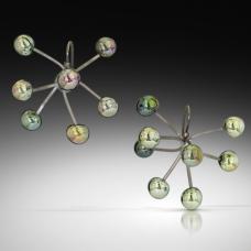 Earrings made from high-silver metallic glass melted directly onto little titanium 'branches'. The branches can be arranged to span out wide in a sputnik shape or cluster more closely together for a different effect.