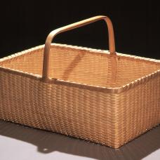 Hand crafted of brown ash splint. Pounded  hand scraped  woven. The handles and rims are hand split  carved  and green bent.