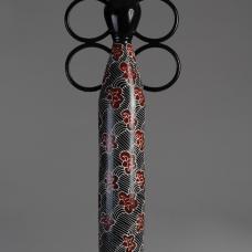 tall ceramic sculpture with floral decoration