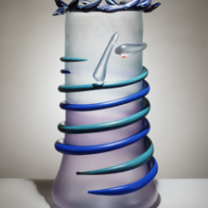 Glass vase with blue glass tendril spiraling downwards