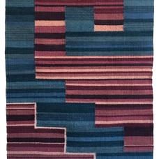 woven rug with an interlocking blue and red step pattern