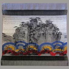 woven image of cliffside with colorful accents