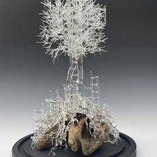 glass tree on stone with ladders