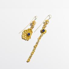 These earrings are part of my Broken Pieces Series. On earring is whole and the other is "broken" in separate pieces.