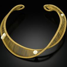 a single thread of 14 k Gold filled wire which also goes though the pearls