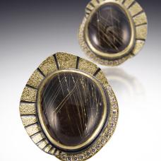 two stones surrounded by gold