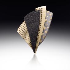 brooch with different textured metals
