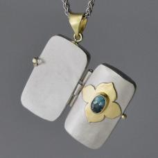 open gold and silver charm