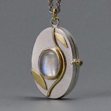 silver, gold, and white charm