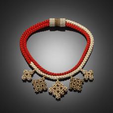 red, ivory, and gold jewelry