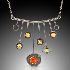 silver and red necklace