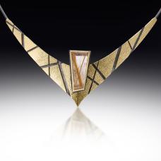 gold and black necklace