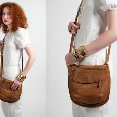 model with leather shoulder bag