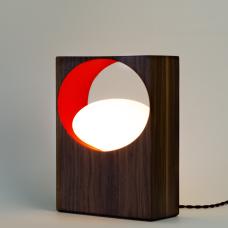 modern wood lamp with light coming from circular negative space