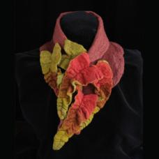 Wet felted Merino wool collar with ruffled ombre chevrons cascading to points in the front. The collar is felted on the bias to hug the neck and features a magnetic closure.