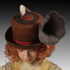 Hand felted Merino wool top hat in the shape of a phonograph. The brim is bound in silk and the crown is encircled with a double grosgrain ribbon.