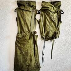 Vintage US Shelter Half military tents made into weatherproof  unisex  versatile vests. Long version has extensive back detail of corset-like strapping. Shorter version has front adjustments only.