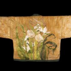 A short kimono made of silk organza. The flowers are made from handmade viscous fiber paper and viscous fiber which are felted onto a fine wool and silk base. The overall texture of the piece is achieved by felting viscous fibers onto a layer of fine wool and silk.