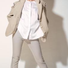 Model with suit, pants have zippers up to the knee