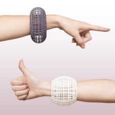 Structurally complex bangle bracelets. They were built in CAD  printed in nylon and hand dyed.