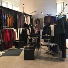 Booth with racks of clothing