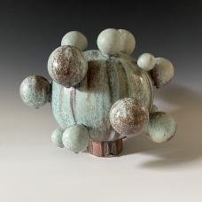 Large stoneware vessel with ceramic sphere extensions. Multiple glazes fired in an atmospheric soda kiln. 2023
